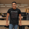Hacker-smiling-man-leaning-on-a-desk